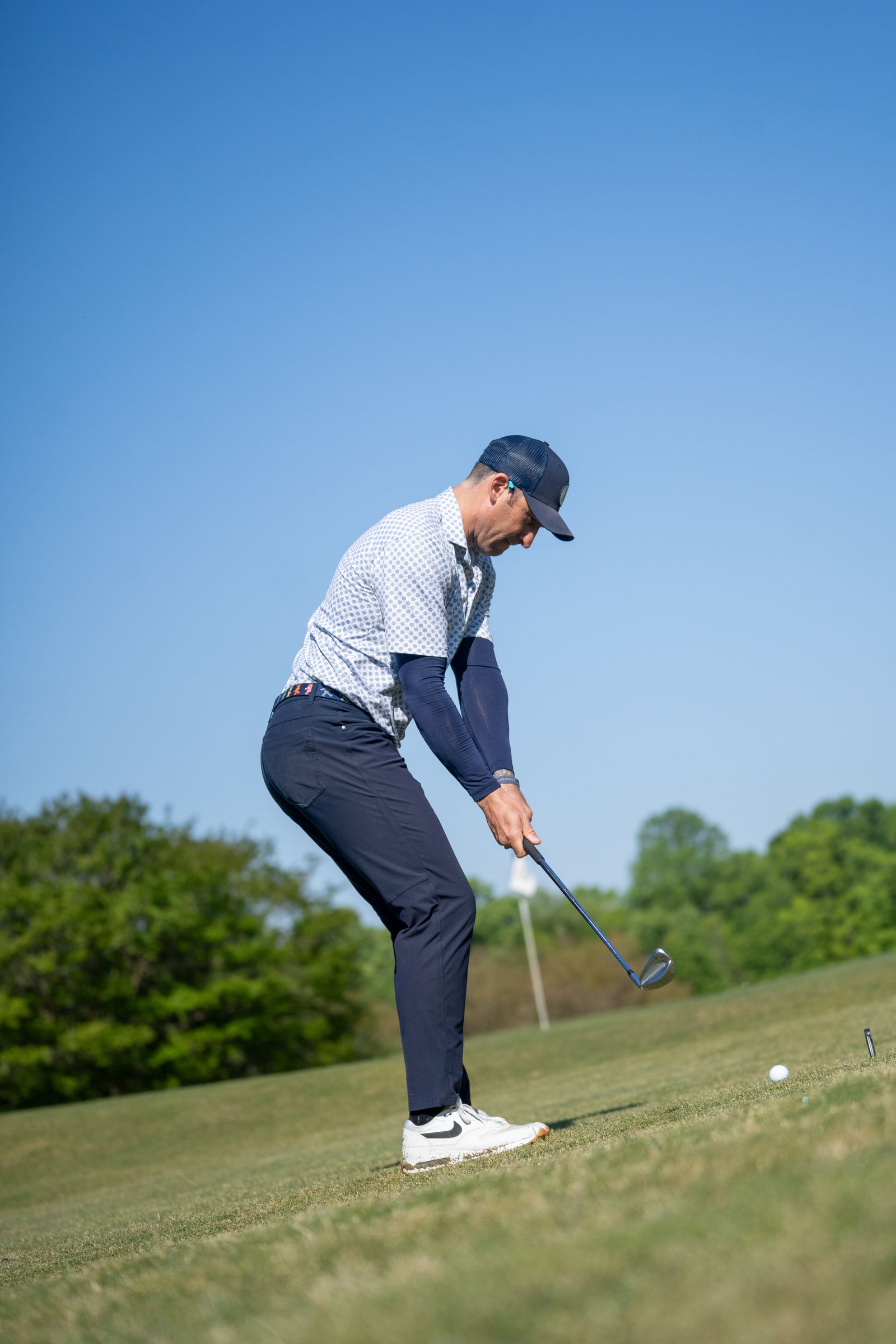 Golfer driving off the tee