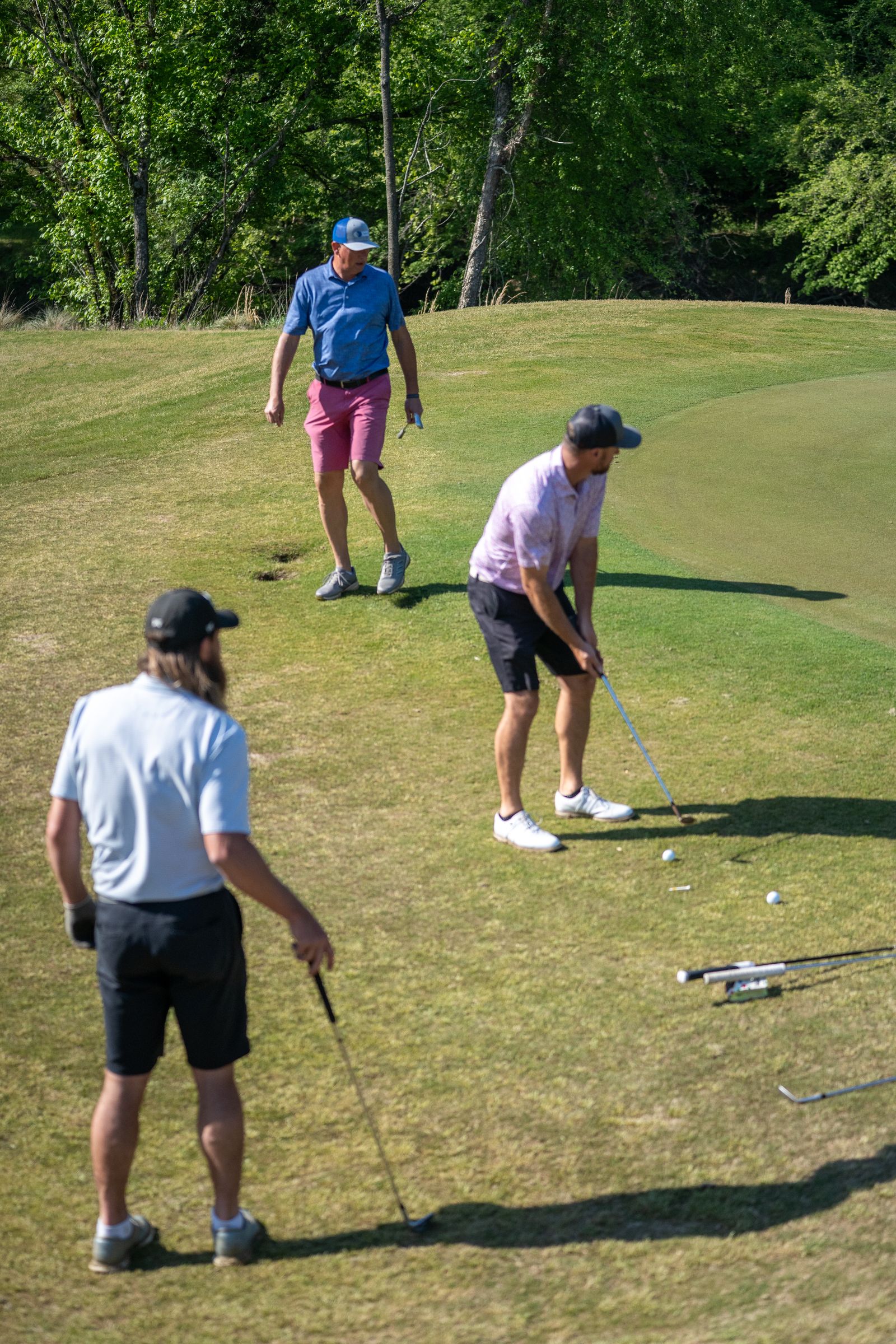 Golfers walking the fairway