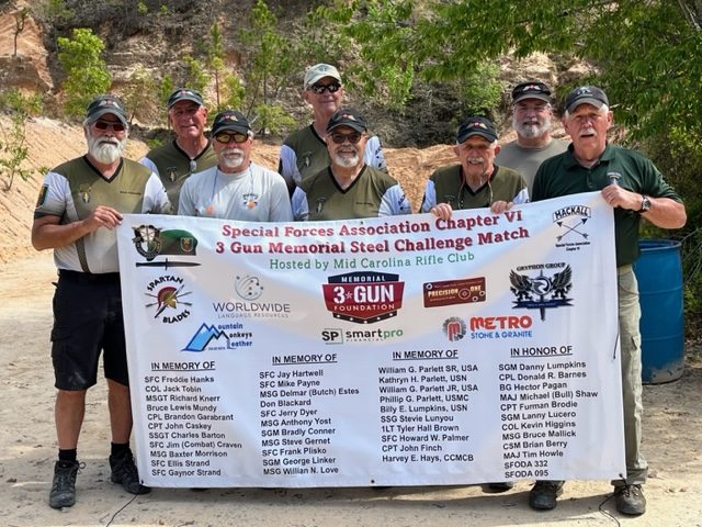 Volunteers holding the Steel Challenge benefit match donor banner