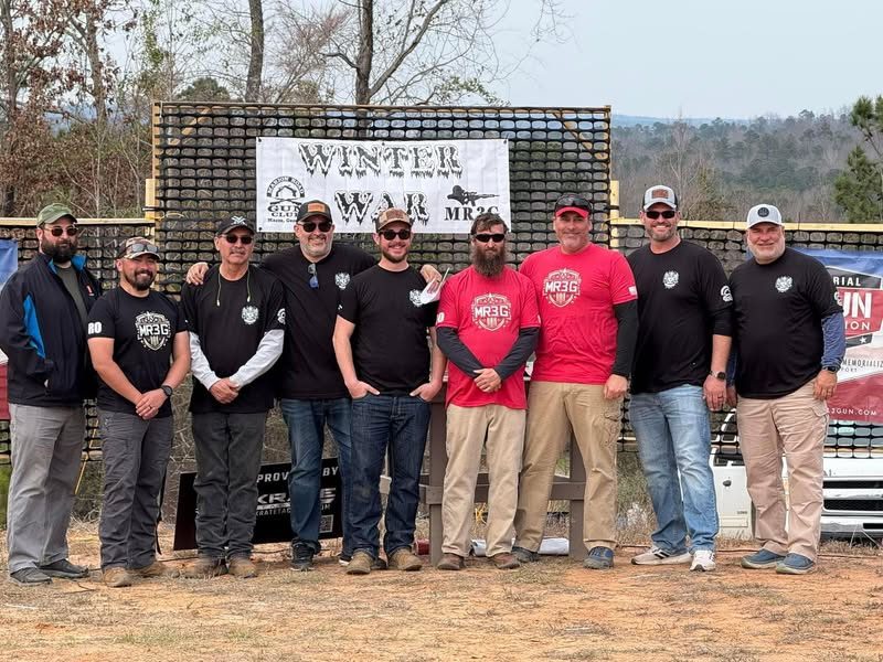 Winter War III match staff under the Winter War banner at Marion Road Gun Club