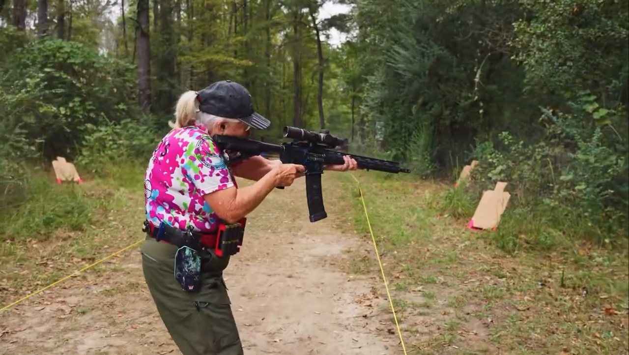 A competitor runs a rifle stage at the Memorial 3 Gun